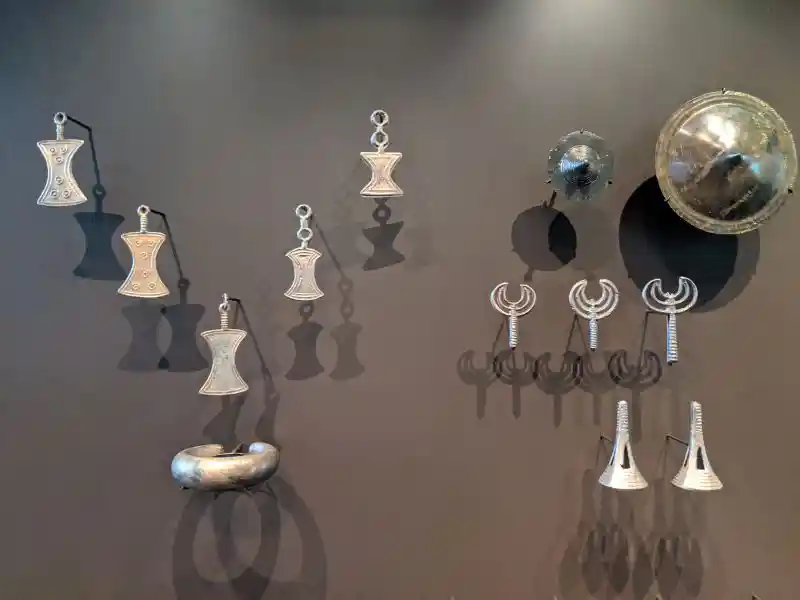 Collection of Bronze Age metal artifacts which includes a variety of finely crafted bronze or copper-alloy items.